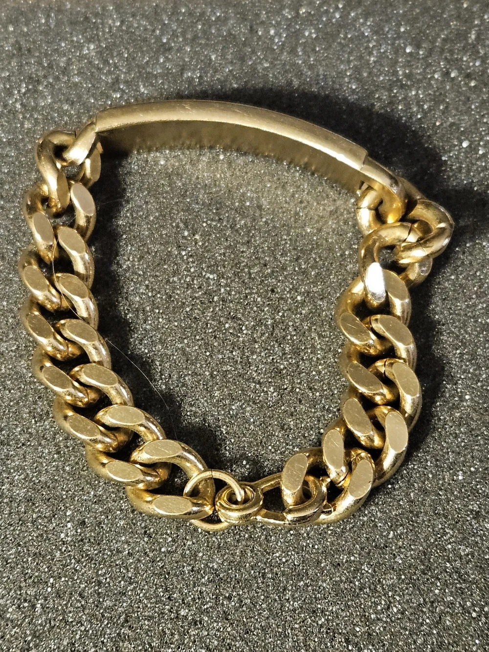 Vintage gold-tone curb-link ID bracelet signed SWANK on the Back identification